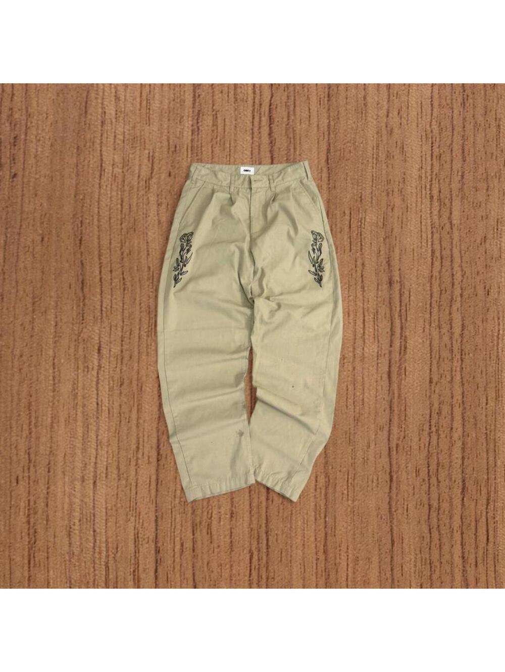 Obey cream embroidered floral pants with black floral embroidery on the sides